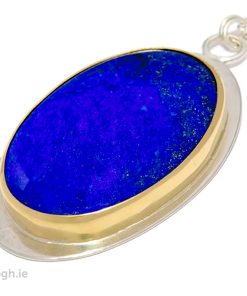 Image of a lapis lazuli oval stone pendant set in gold bezel on sterling silver back.